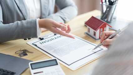 Insurance concept the broker explaining the agreement of the contract to his customer