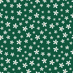 White tiny flowers on green background.