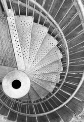 A metallic round staircase from above