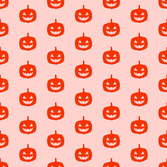 Pink seamless pattern with halloween scary pumpkin.