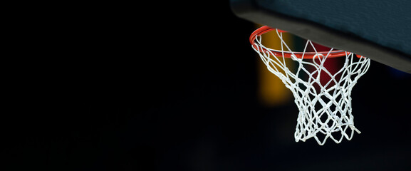 Basketball hoops against dark background. Banner art concept. Horizontal sport theme poster,...