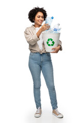 recycling, waste sorting and sustainability concept - smiling woman holding recycle bin with plastic bottles over white background