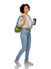 eco living, zero waste and sustainability people concept - happy smiling woman with thermo cup and...