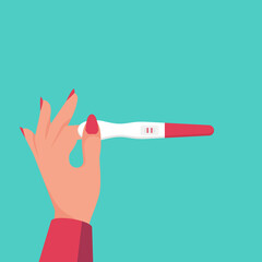 Woman holding in hand positive pregnancy test with two red stripes.