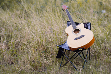 Guitars, camping, such as stoves, chairs, on sunny days outdoors. outdoor romantic hippie