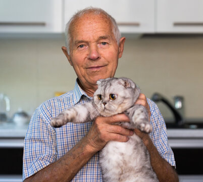 Portrait Of Old Man With Cat