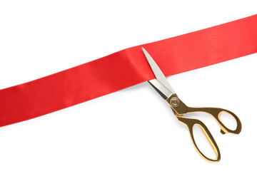 Ribbon and scissors on white background, top view