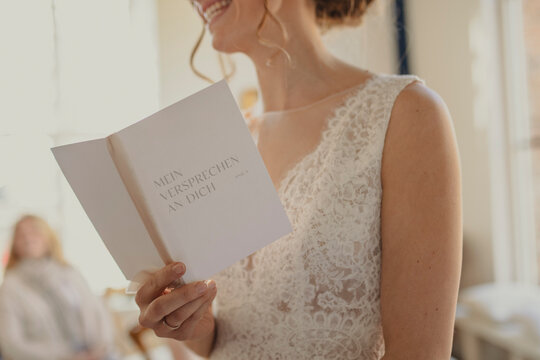 woman reading a wedding programme