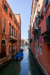 Fototapeta na wymiar Canals, bridges and buildings in the city of Venice Italy. classic buildings, blue water canals.