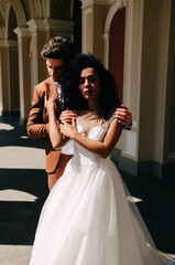 Beautiful African American girl in wight dress with her husband