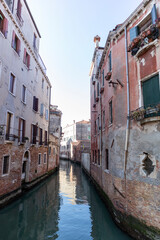 Canals, bridges and buildings in the city of Venice Italy. classic buildings, blue water canals.