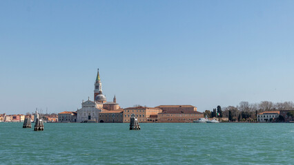 Fototapeta premium Canals, bridges and buildings in the city of Venice Italy. classic buildings, blue water canals.