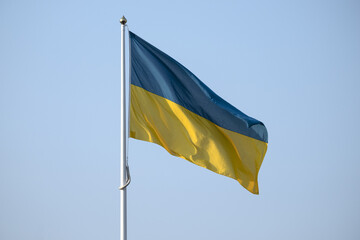 Ukraine flag with blue sky - obrazy, fototapety, plakaty