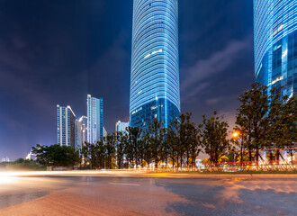 Fototapeta na wymiar the light trails on the modern building background in shanghai china.
