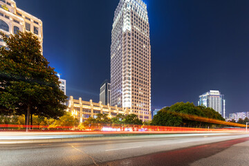 Fototapeta premium moving car with blur light through city at night