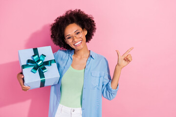 Photo of confident promoter lady suggest sale season gifts empty space wear denim shirt isolated...