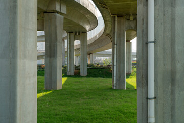 Concrete structure and asphalt road space under the overpass in the city - Powered by Adobe