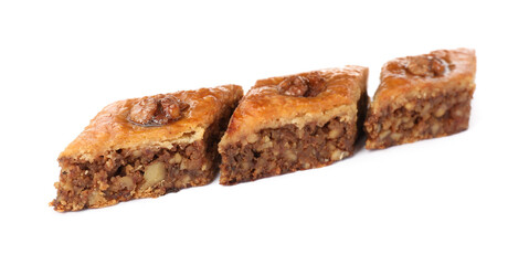 Delicious honey baklava with walnuts on white background