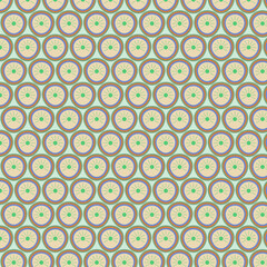 Seamless pattern of round figures on a light green background.