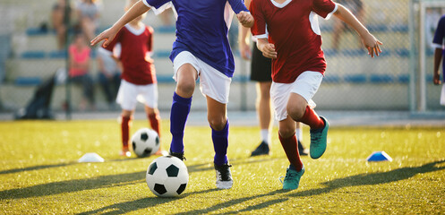 Running Soccer Football Players. Footballers Kicking Football Game on Training Unit. Young Soccer...