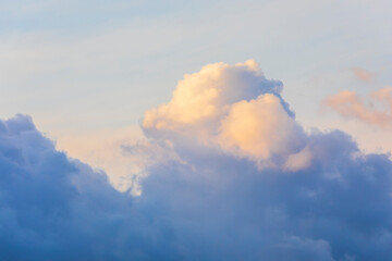 Beautiful clouds illuminated by the sun at sunset
