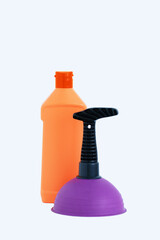 A purple plunger with  black handle and an orange bottle of detergent. White background.