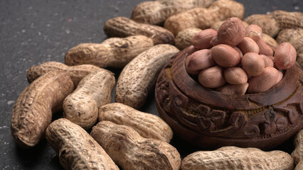 Composition of peanuts serving to make oil, peanut butter. Great for healthy and dietary nutrition. Concept of: condiments, dried fruit, food.