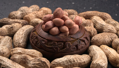 Composition of peanuts serving to make oil, peanut butter. Great for healthy and dietary nutrition. Concept of: condiments, dried fruit, food.