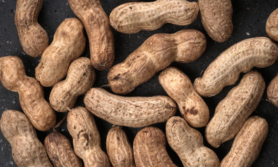 Composition of peanuts serving to make oil, peanut butter. Great for healthy and dietary nutrition. Concept of: condiments, dried fruit, food.