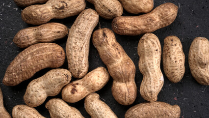 Composition of peanuts serving to make oil, peanut butter. Great for healthy and dietary nutrition. Concept of: condiments, dried fruit, food.