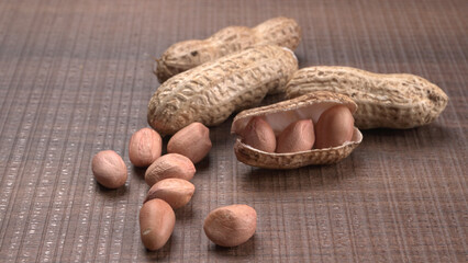 Composition of peanuts serving to make oil, peanut butter. Great for healthy and dietary nutrition. Concept of: condiments, dried fruit, food.