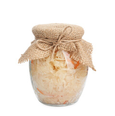 Glass jar of tasty fermented cabbage with carrot on white background