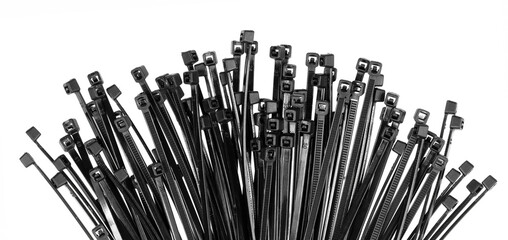 Black plastic cable ties isolated on white background. plastic wire ties closeup. - Powered by Adobe