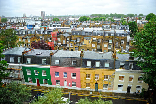 Brick houses with colored facades in the Fulham neighborhood. Cityscape of Fulham, London, UK