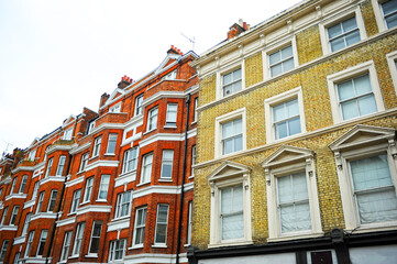 Brick houses with colored facades in the Chelsea district. Chelsea Cityscape, London, UK