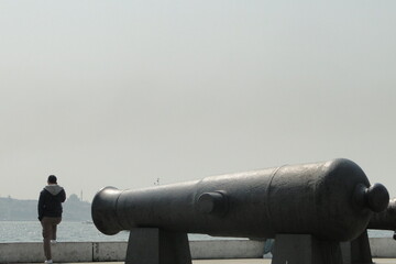 old ottoman cannon pointing on a man in Besiktas in Istanbul Turkey