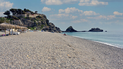 View of landmark San Cristobal rock formation and beach in the Mediterranean town of Almuñecar,...