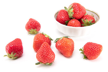 Fresh ripe strawberries in ceramic bowl and on white background. japanese fruit. Selective focus