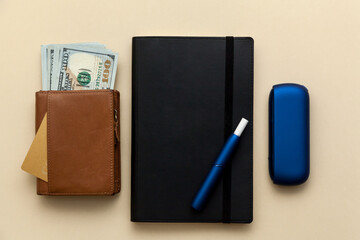 Iqos electronic blue cigarette on a beige background.