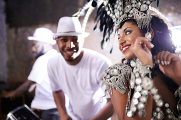 Performing a live show. Cropped shot of a beautful female dancer with her band in the background.