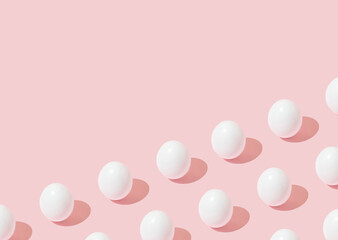 Easter background pattern with white eggs on pink background and copy space.