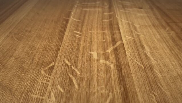 Rolling a set of blue dice on a wooden table