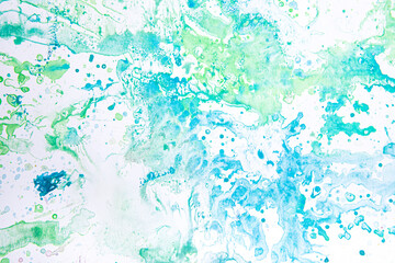 watercolor spots of green and blue on a white background. texture. bright spots and splashes of paint on the paper.