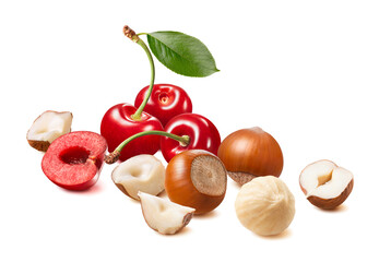 Red sweet cherries and hazelnuts isolated on white background. Whole nuts and broken pieces.