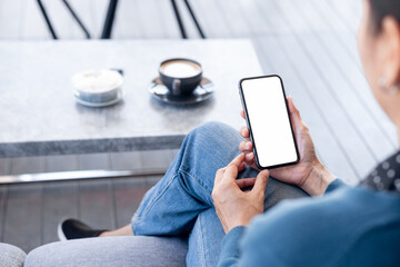 cell phone blank white screen mockup.hand holding texting using mobile on desk at office.background empty space for advertise.work people contact marketing business,technology