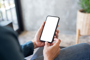 cell phone blank white screen mockup.hand holding texting using mobile on desk at office.background empty space for advertise.work people contact marketing business,technology