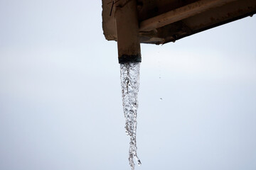 Close-up of water gushing out of the steel pipe