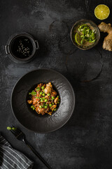 soba with mushrooms on a dark background