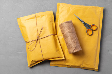 Lot of yellow paper postal envelopes. Top view.