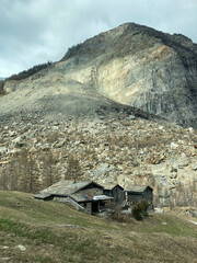 Old Houses in front of the Big Rock Slide of Randa in the Canton of Wallis of the Year 1991 in...